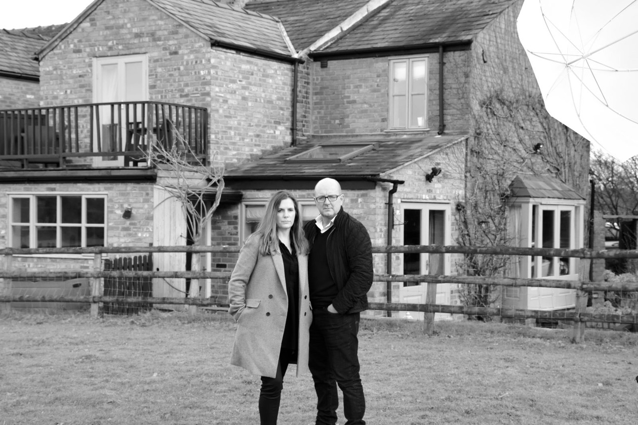 Justine & Trevor Palin outside their doomed home
