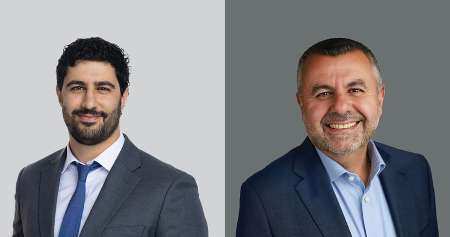 Two professional men wearing suits smiling against plain backgrounds.