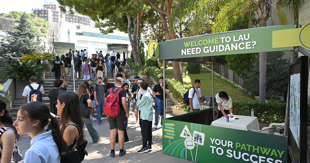 Crowd of students on campus during the welcome event. 